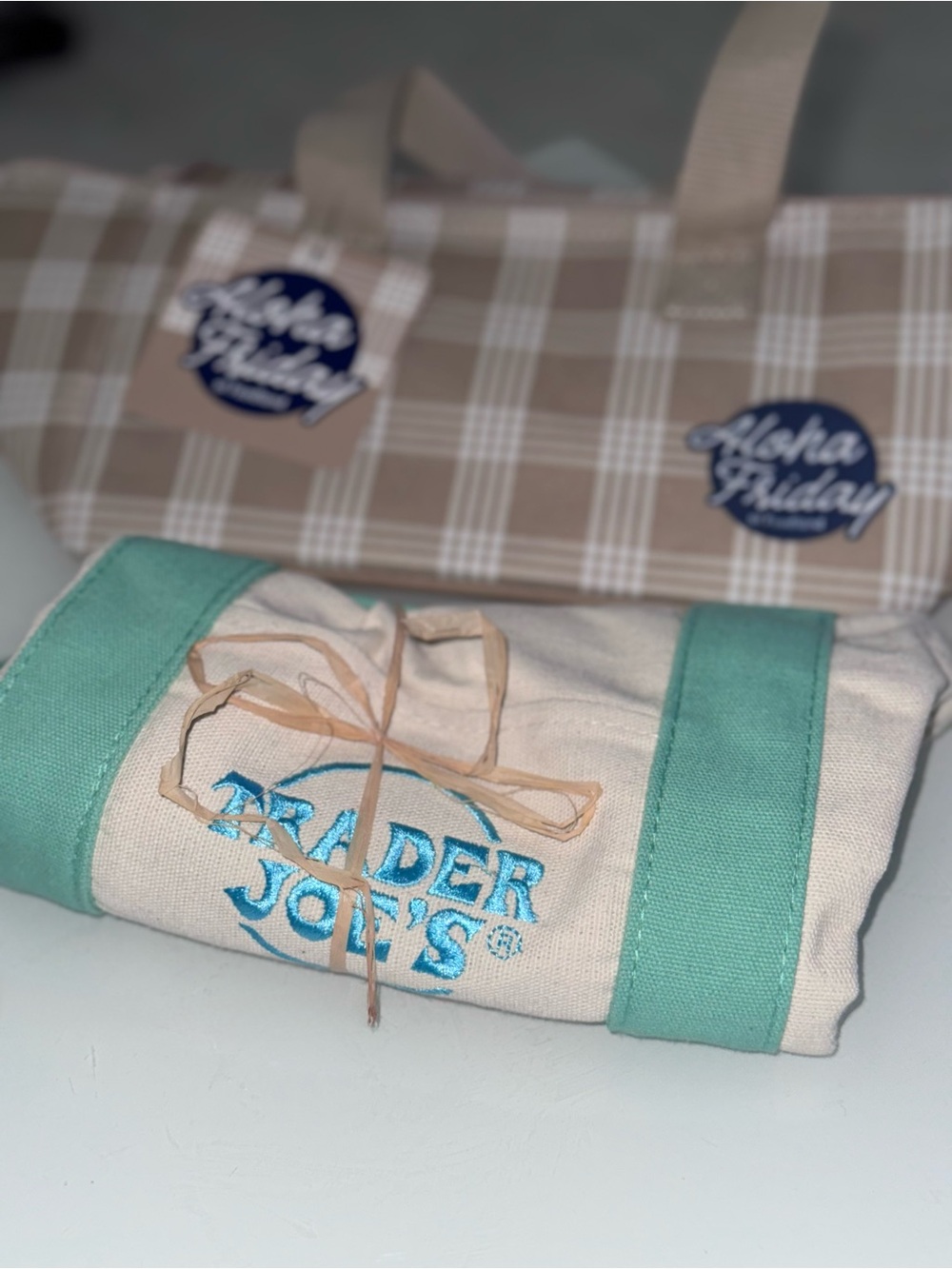 Mini Trader Joe mint green tote and Foodland beige palaka mini cooler